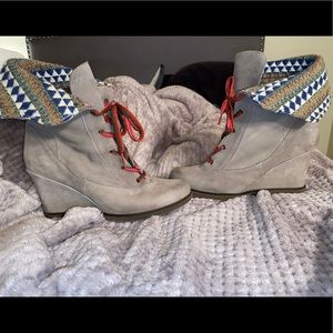 Grey holding horses wedges